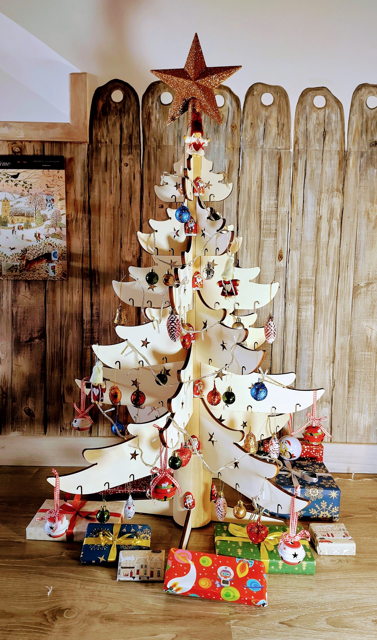 3 foot modular, natural wooden Christmas tree decorated with Xmas baubles, fairy lights and a star. 